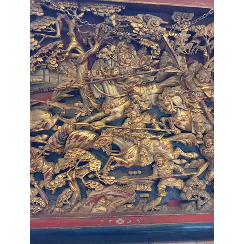 759 - A Chinese chaozhou giltwood and red lacquered carved panel, 19th century, the rectangular panel carv... 