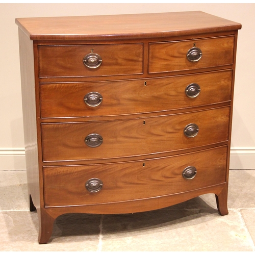 1001 - An early 19th century mahogany bowfront chest of drawers, formed with two short over three long grad... 