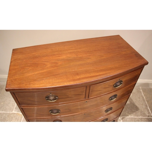 1001 - An early 19th century mahogany bowfront chest of drawers, formed with two short over three long grad... 