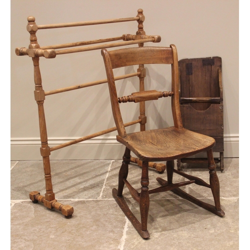 1022 - A Victorian elm and beech rail back rocking chair, 72cm H, (at fault), a Victorian pine towel rail, ... 