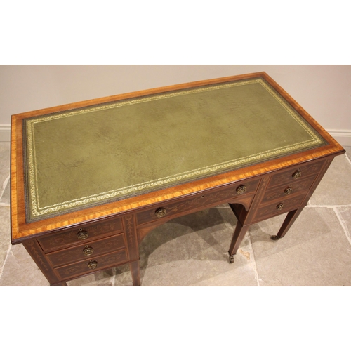 1048 - An Edwardian Sheraton Revival writing desk, by Edwards & Roberts, the rectangular top inset with a g... 