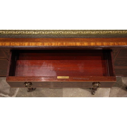 1048 - An Edwardian Sheraton Revival writing desk, by Edwards & Roberts, the rectangular top inset with a g... 