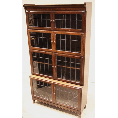 1057 - An oak Globe Wernicke type bookcase, early 20th century, formed with four graduated tiers, each with... 