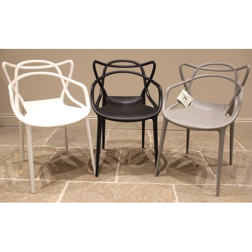 1071 - A harlequin trio of Kartell Masters stacking chairs, by Philippe Stark, each impressed with the make... 