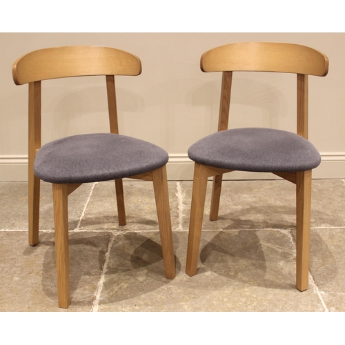 1076 - A pair of contemporary light oak and upholstered dining chairs, made in Italy for Heal's, early 21st... 