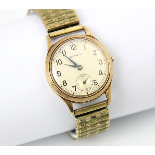 115 - A 9ct yellow gold Garrard wristwatch, the circular dial with Arabic numerals and subsidiary dial to ... 