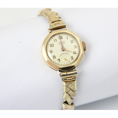 115 - A 9ct yellow gold Garrard wristwatch, the circular dial with Arabic numerals and subsidiary dial to ... 