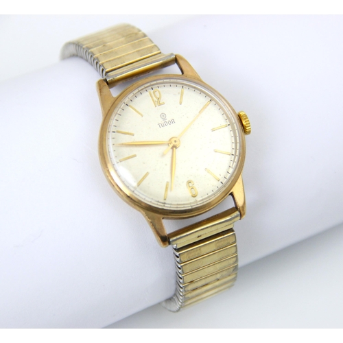 125 - A 9ct yellow gold gentleman’s Tudor wristwatch, the circular cream dial with Arabic numerals and bat... 