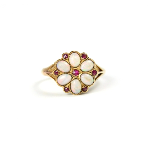 129 - An 18ct yellow gold opal and untested ruby cluster ring, the oval cabochon opals within a petal desi... 