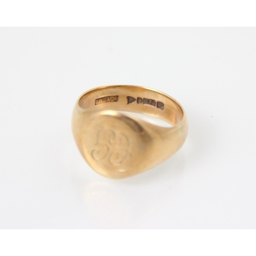 135 - A 9ct yellow gold signet ring, the oval cartouche with 'CG' monogram leading to plain polished shank... 