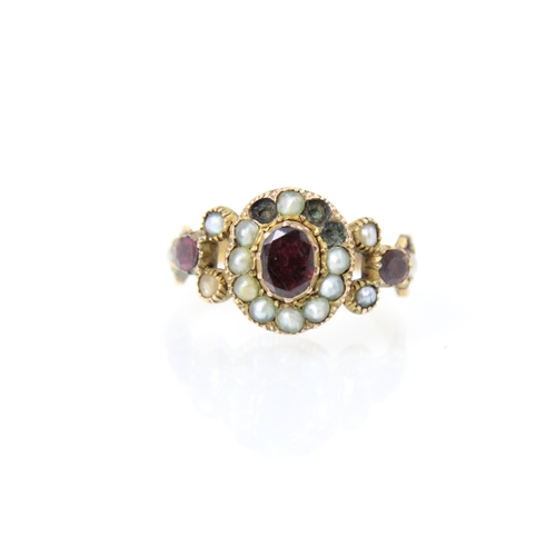 137 - A 19th century split pearl and red stone ring, the red stone centre (possibly foil backed) with surr... 