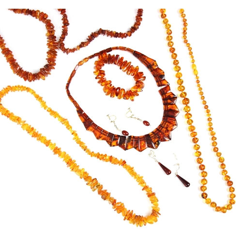 166 - A selection of 'amber' coloured jewellery, including an 'amber' coloured collar style panel necklace... 