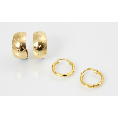 176 - A pair of yellow metal hoop earrings, the faceted hoops with post fittings, stamped ‘916’ with a fur... 