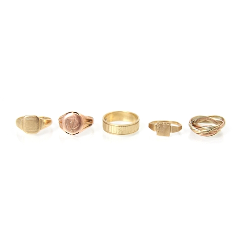 186 - A selection of five 9ct yellow gold and yellow metal rings, including three signet ring examples, ri... 