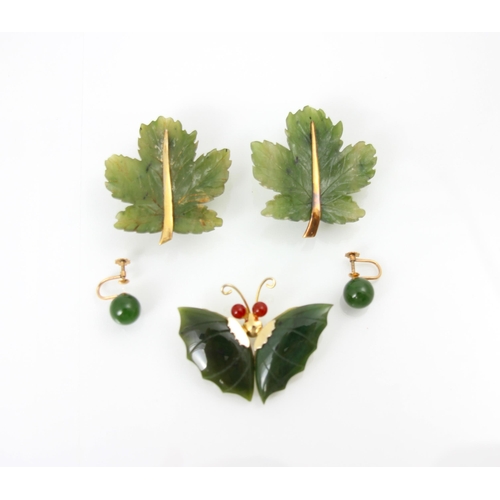 216 - A selection of nephrite jewellery, including a pair of brooches, carved as a leaf, 4.5cm long, a fur... 