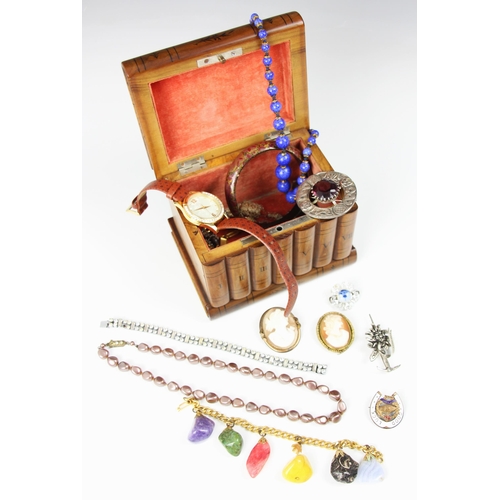 224 - A selection of costume jewellery, including two cameo brooches, paste set necklaces, a lapis lazuli ... 