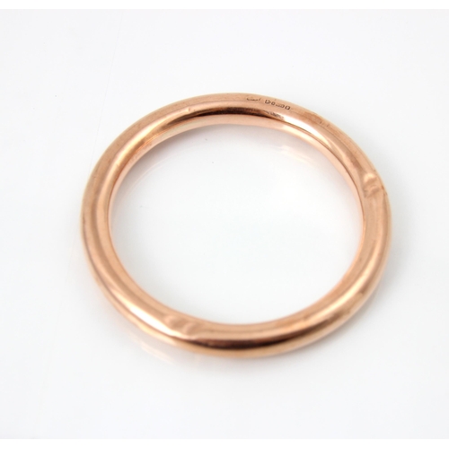 231 - A 20th century 9ct rose gold bangle, the hollow bangle stamped 'HG&S' Chester 1924, 18gms, 9cm exter... 