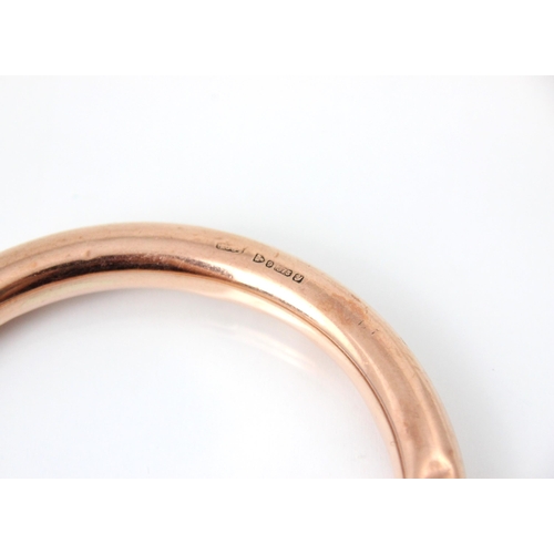 231 - A 20th century 9ct rose gold bangle, the hollow bangle stamped 'HG&S' Chester 1924, 18gms, 9cm exter... 