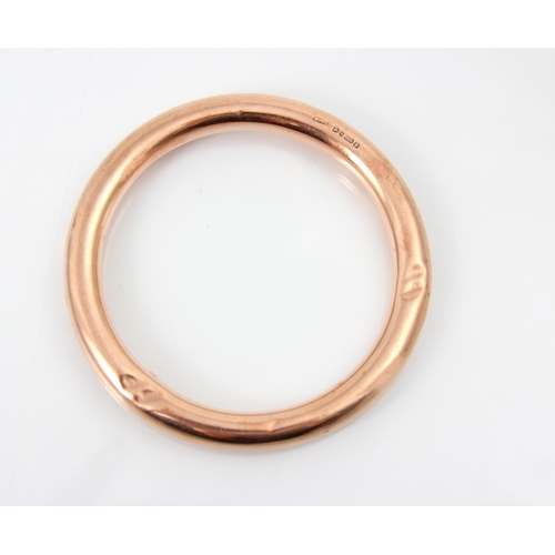 231 - A 20th century 9ct rose gold bangle, the hollow bangle stamped 'HG&S' Chester 1924, 18gms, 9cm exter... 