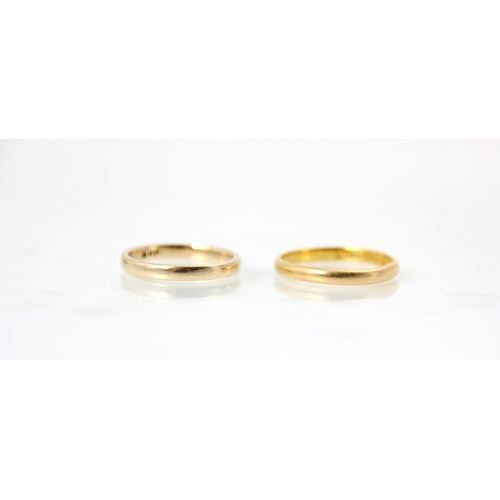 235 - A 22ct yellow gold wedding band, stamped 'ACCo', Birmingham 1931, ring size N, 2gms, with a 9ct yell... 