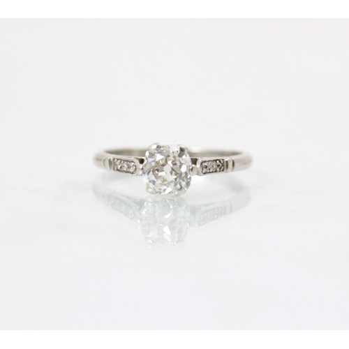 236 - An early 20th century diamond solitaire ring, the old cut diamond within white metal claw setting ed... 