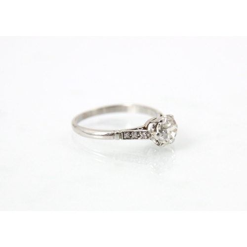 236 - An early 20th century diamond solitaire ring, the old cut diamond within white metal claw setting ed... 