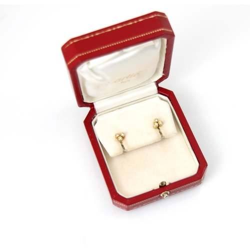 238 - A pair of Cartier diamond set stud earrings, stamped ‘Cartier 750’ to reverse, the trefoil designed ... 