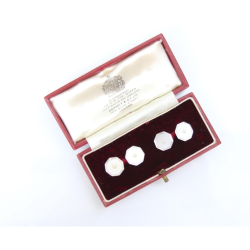 239 - A pair of 9ct white gold Art Deco style cufflinks, the octagonal link set with central split pearl, ... 