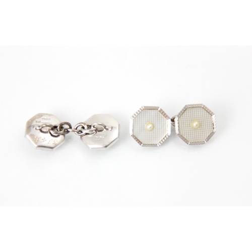 239 - A pair of 9ct white gold Art Deco style cufflinks, the octagonal link set with central split pearl, ... 