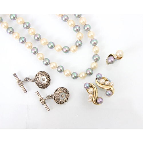 240 - A selection of jewellery including a pair of white metal and pearl coloured cufflinks, the circular ... 