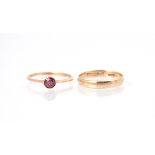 241 - A 9ct yellow gold wedding band, stamped ‘JHW’ Chester 1926, ring size M, with an amethyst set 9ct ye... 