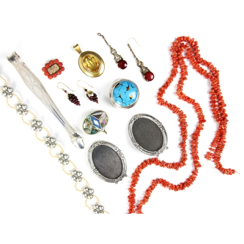 243 - A selection of costume jewellery, including a 19th century style coral and hairwork brooch, with hin... 