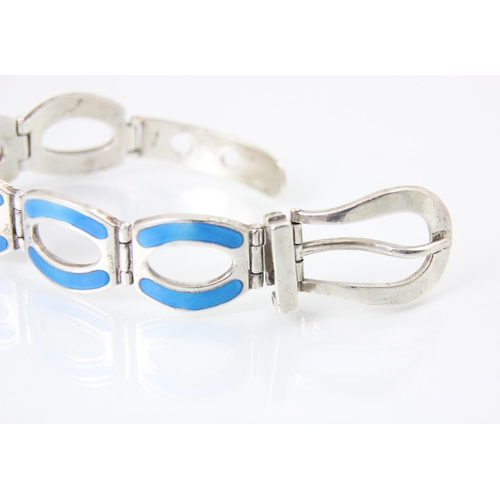 244 - A silver and enamel bracelet, the oval links with blue enamel with stylised buckle fastening, stampe... 