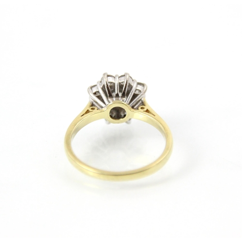 245 - An Edwardian style 18ct yellow gold diamond cluster ring, the central round cut diamond within a sur... 