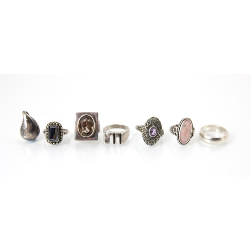 248 - A selection of silver and silver coloured rings, including two marcasite set cluster rings, a brutal... 