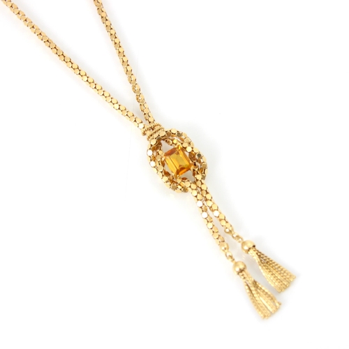 253 - A yellow metal and citrine set negligee style necklace, the rectangular cut citrine set within knott... 