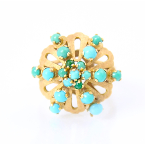 257 - A yellow metal and turquoise coloured dress ring, the twenty round cabochon cut blue stones within o... 