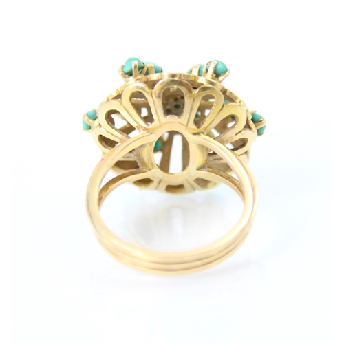 257 - A yellow metal and turquoise coloured dress ring, the twenty round cabochon cut blue stones within o... 