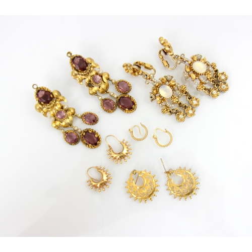 274 - A quantity of fine costume earrings, including a pair of Etruscan style purple paste set drop earrin... 