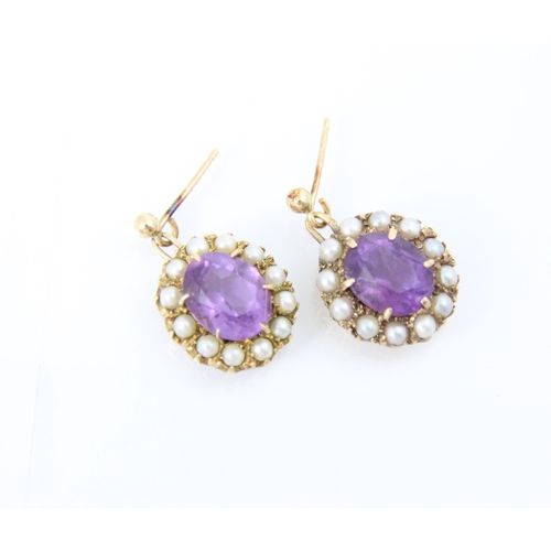 278 - A pair of yellow metal amethyst and cultured pearl earrings, the cluster designed earrings with oval... 