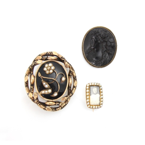 279 - A 19th century mourning brooch/locket, the front with a floral depiction set with baroque pearls to ... 