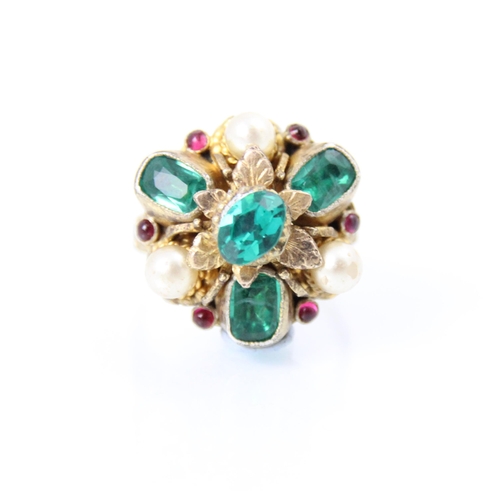 281 - A 19th century untested emerald and ruby stylised cluster ring, the three emerald cut green stones w... 