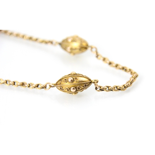 287 - A 19th century yellow metal chain, the engraved links of the chain lead to three lozenge shaped link... 