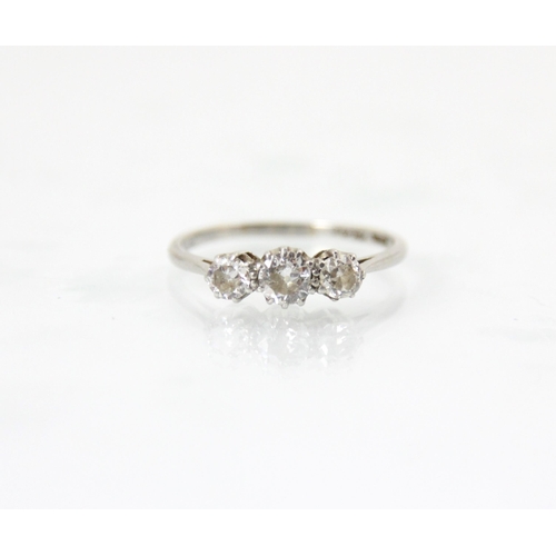 288 - A mid 20th century diamond three stone ring, the central transitional cut diamond with smaller trans... 