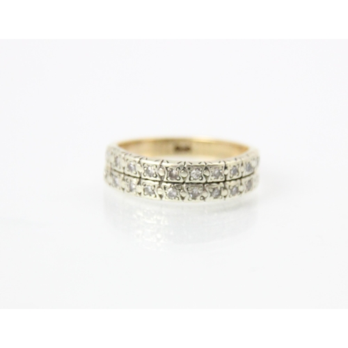 290 - A diamond set double half eternity ring, the rows of round cut stones set within spitch set white me... 