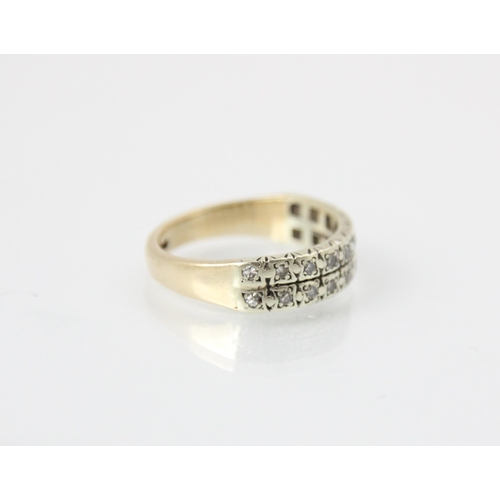 290 - A diamond set double half eternity ring, the rows of round cut stones set within spitch set white me... 