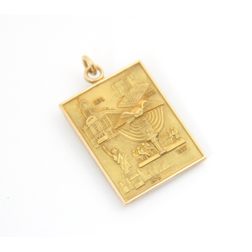 292 - A yellow metal ‘Centennial’ ingot pendant, the rectangular pendant with cast lettering ‘Centennial 1... 