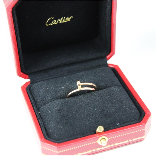 300 - A rose gold 'Screw' ring, by Cartier, the plain polished ring modelled as twisted screw, stamped 'Ca... 