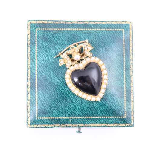 302 - A Victorian style split pearl and onyx coloured pendant/brooch, the polished heart shaped onyx colou... 