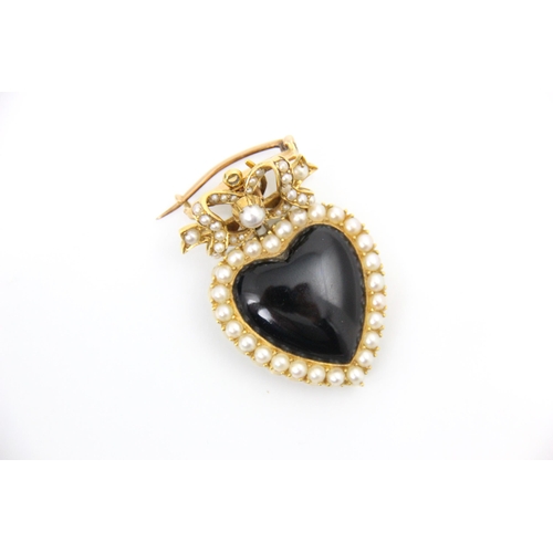 302 - A Victorian style split pearl and onyx coloured pendant/brooch, the polished heart shaped onyx colou... 